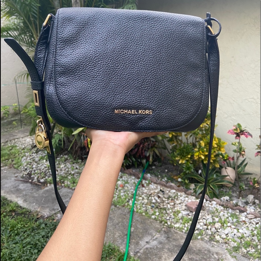 Michael Kors dark blue leather handbag.